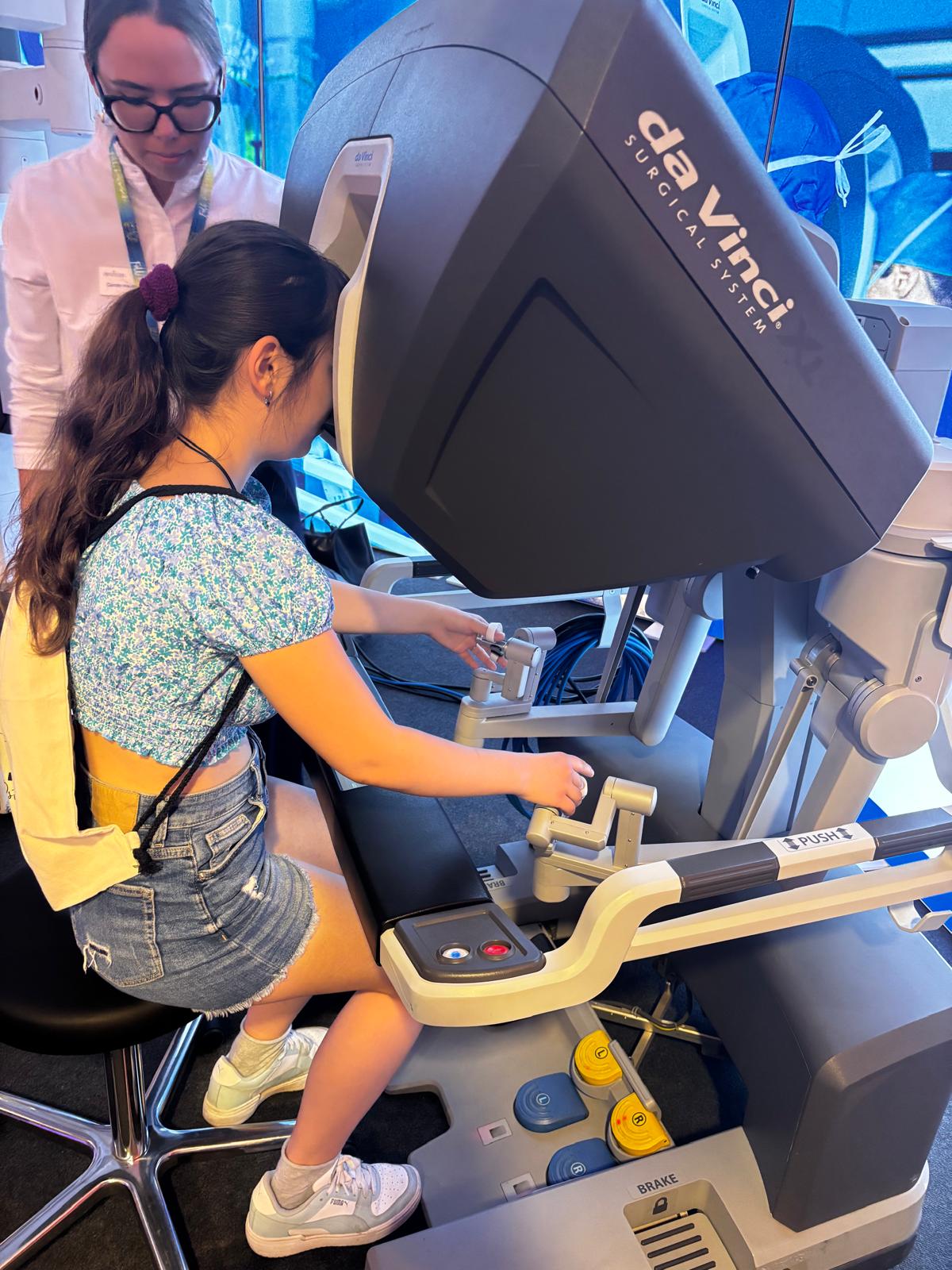 Marika exploring a da Vinci surgical robotics system
